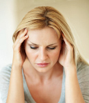 Portrait of upset middle aged woman having head pain